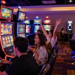Players celebrating a win at a slot gacor machine in a lively casino atmosphere.